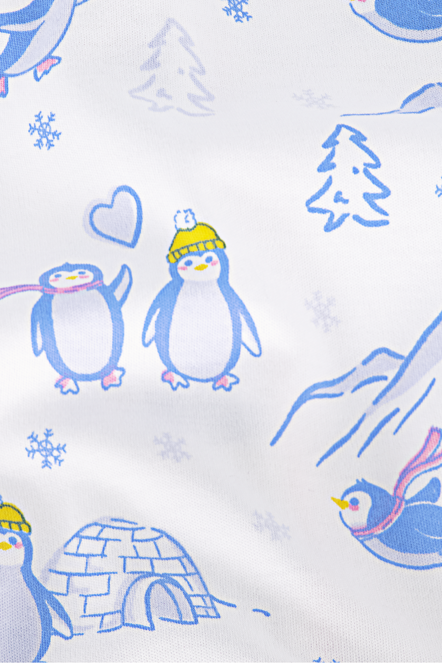 The Penguin Party Long Sleeve Polo Pajamas feature cozy Pima cotton with cartoon penguins in yellow hats and scarves, snowflakes, pine trees, an igloo, and hearts on a blue and yellow print over a white background.