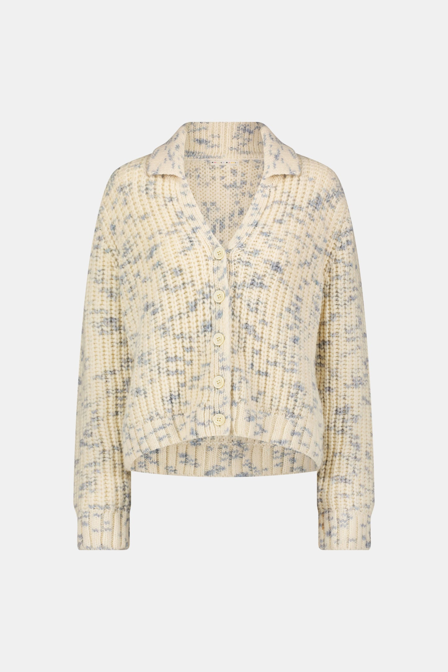 The Space Dye Dhalia Cardigan is a cream, button-up baby alpaca cardigan with a blue speckled pattern, long sleeves, and a collar, shown on a plain white background.