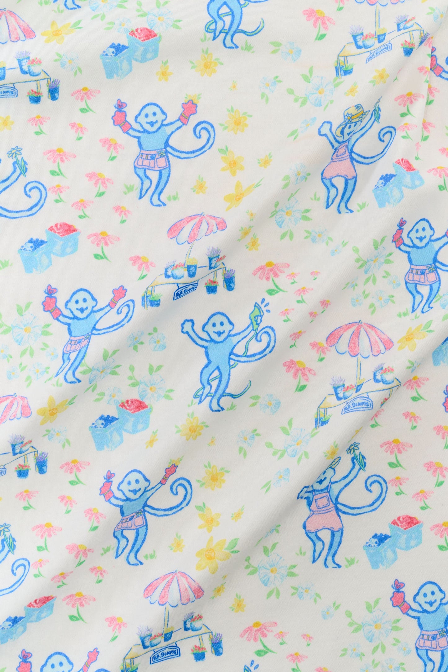 Fabric with colorful monkey pattern on a white background