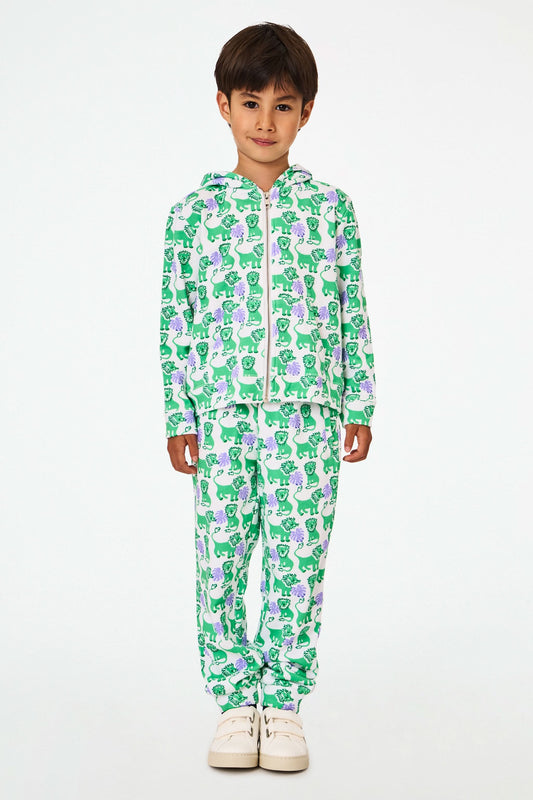 A young child wears the Roller Rabbit Kids Leo The Lion Harley Hoodie, a green and purple French terry zip-up with matching pants, featuring a Leo the Lion print, posing with hands in pockets against a plain white background.
