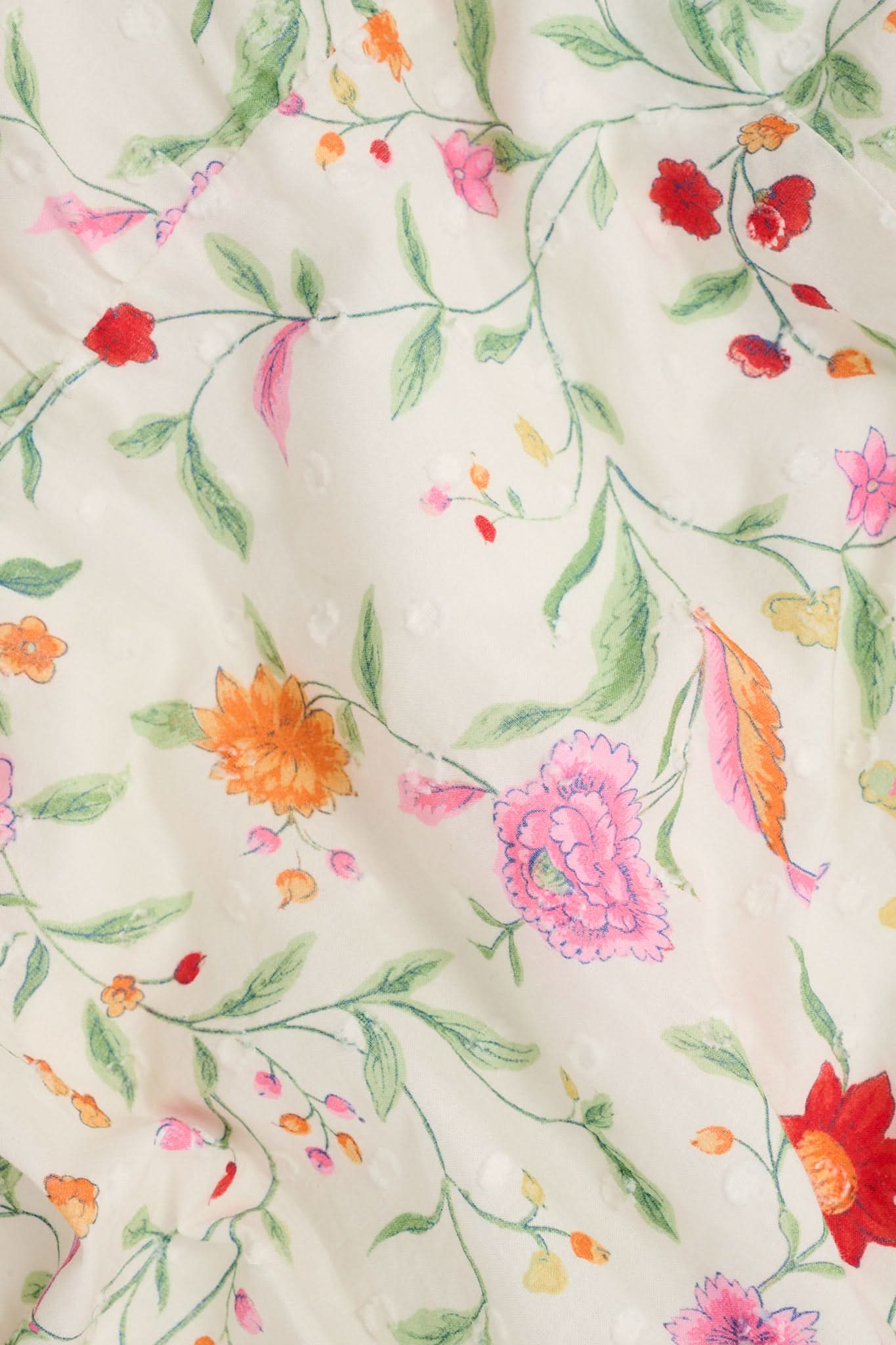 A woman wears the Roller Rabbit Baroque Floral Saylor Set—light cotton loungewear with a sleeveless ruffled top and loose shorts—standing with one hand in her pocket against a plain background.