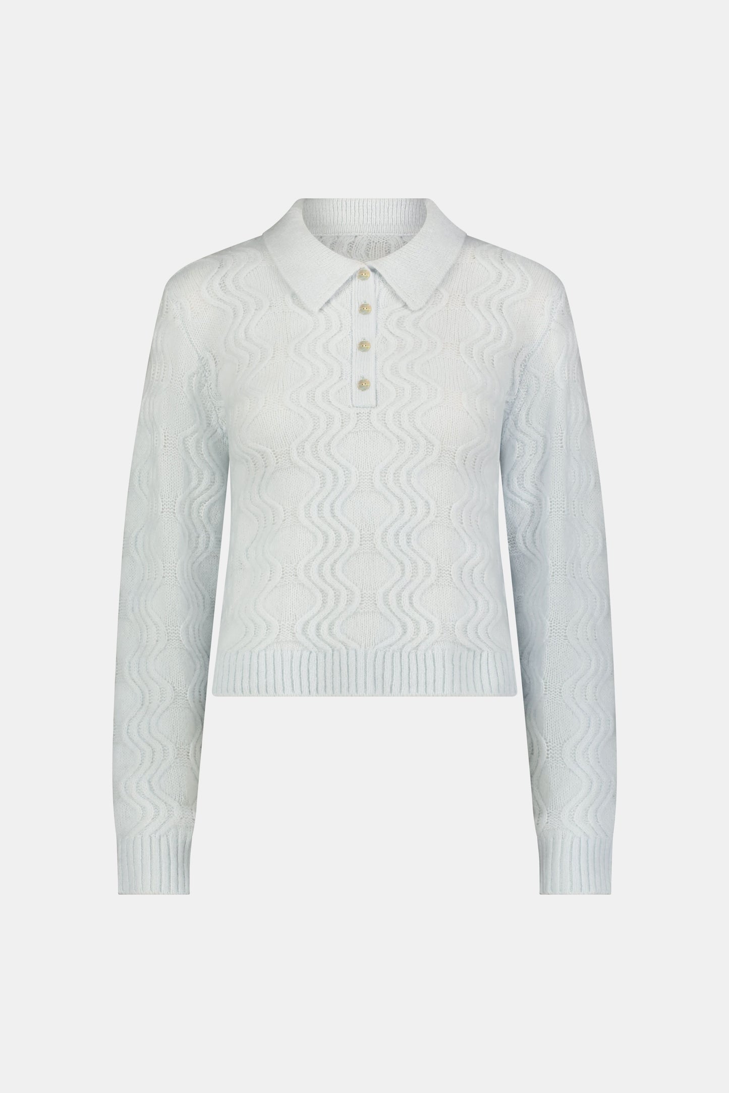 The Wave Knit Ava Sweater features a light blue wavy texture, ribbed hem and cuffs, white collar, and buttoned placket—an elegant addition to any outfit.