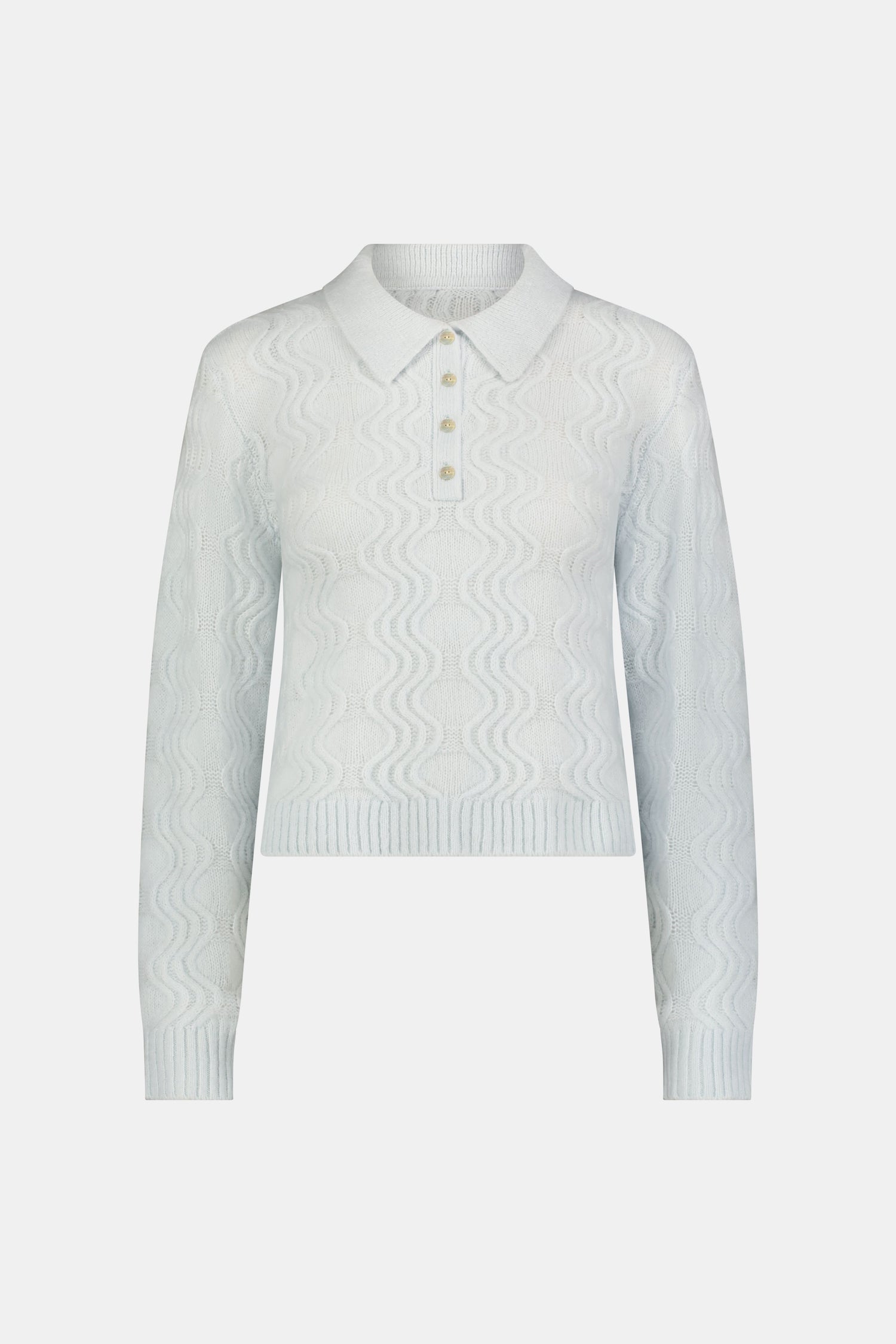 The Wave Knit Ava Sweater features a light blue wavy texture, ribbed hem and cuffs, white collar, and buttoned placket—an elegant addition to any outfit.