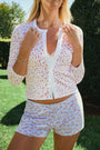 Wearing Roller Rabbit’s Breakfast In Bread Sullivan Shortie pajamas, a person stands against a white background.
