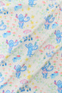 Fabric with colorful monkey pattern on a white background