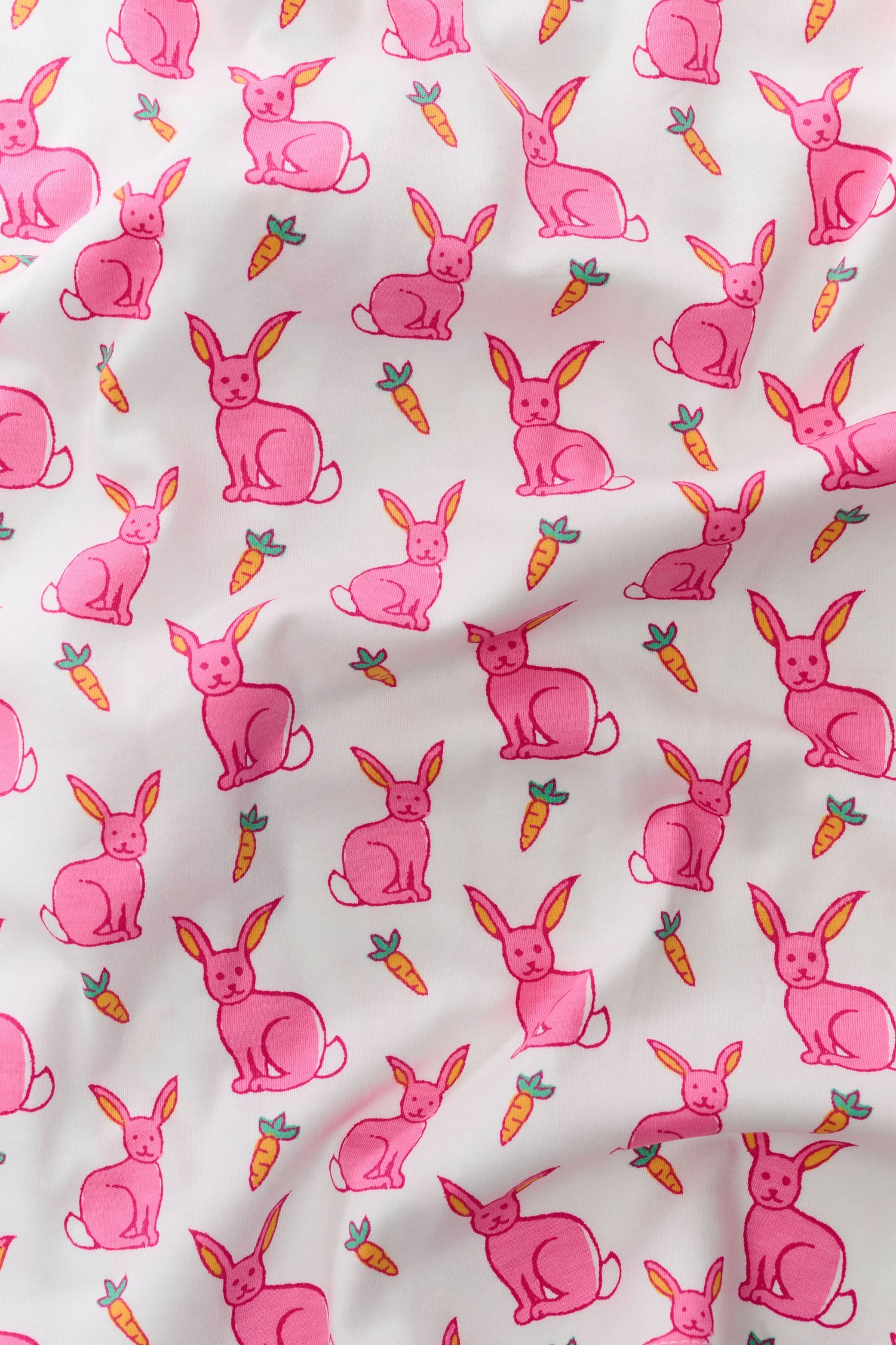 The Roller Rabbit Infant Romy the Rabbit Zipper Footie is a white Pima cotton pajama with long sleeves and pink bunny prints, featuring a convenient two-way front zipper closure.