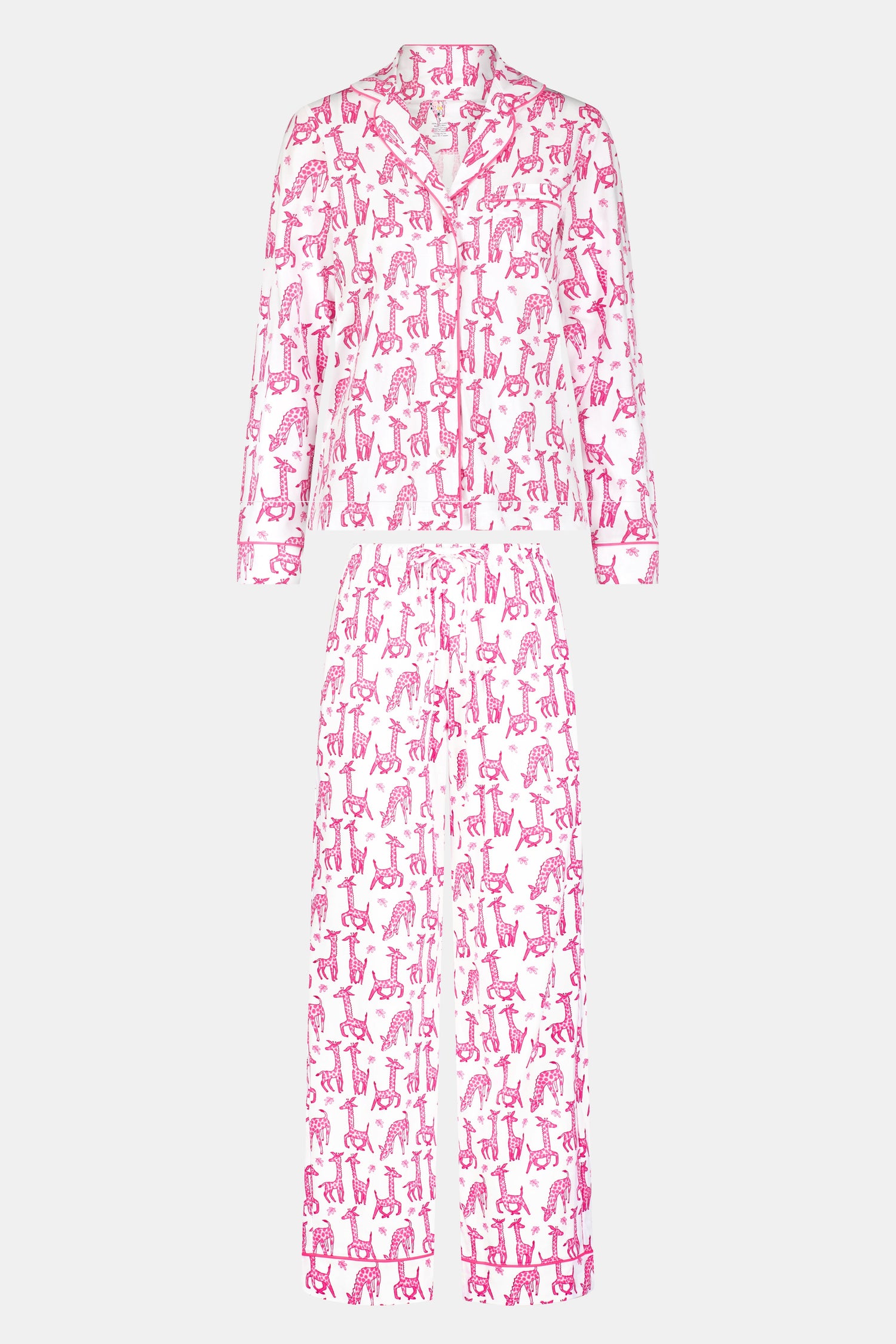 The Roller Rabbit Gigi Giraffe Long Sleeve Polo Pajamas feature a matching set with long sleeves and pants, showcasing an all-over pink giraffe print on a white background.