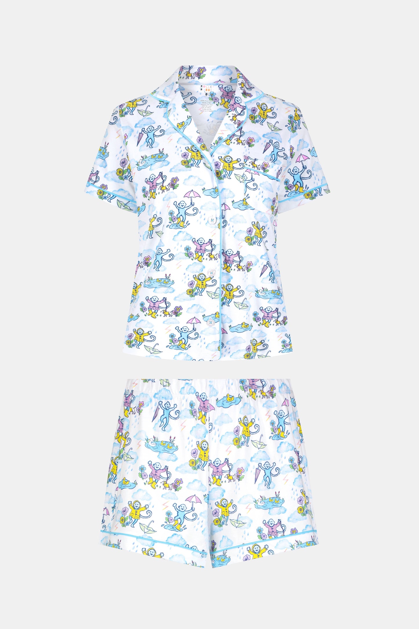 The April Showers Polo Pajamas by Roller Rabbit is a short-sleeved, button-up Pima cotton set with matching shorts, featuring a colorful aquatic animal print in blue, yellow, and purple on white.