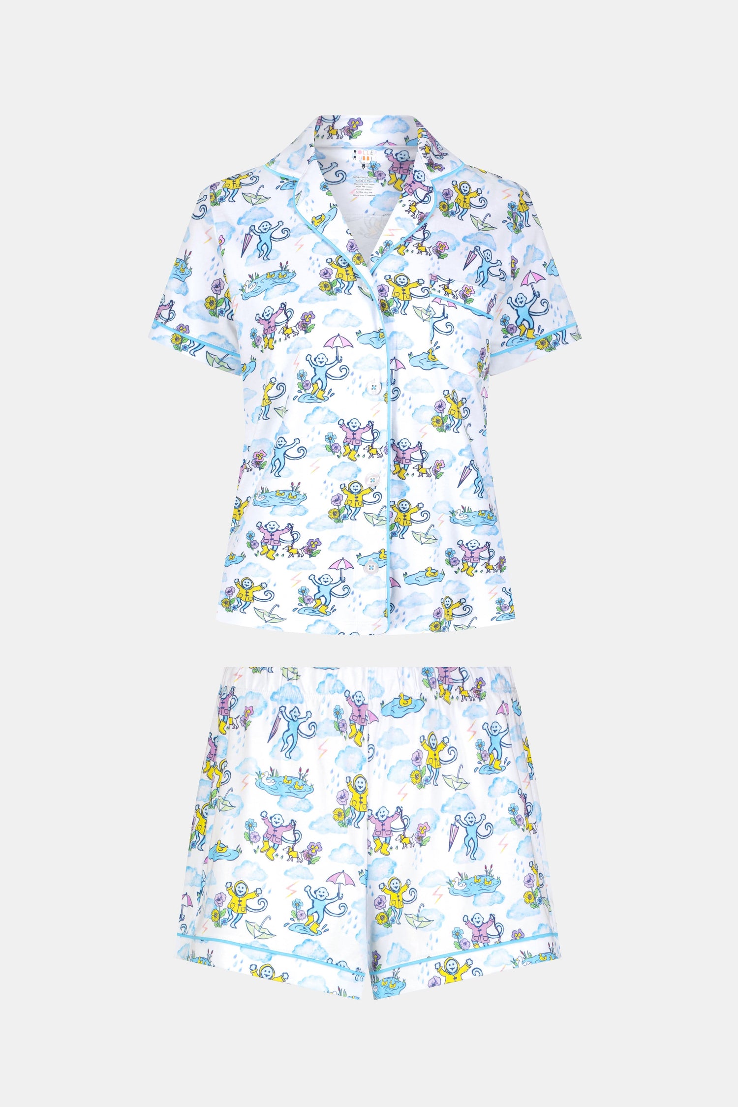 The April Showers Polo Pajamas by Roller Rabbit is a short-sleeved, button-up Pima cotton set with matching shorts, featuring a colorful aquatic animal print in blue, yellow, and purple on white.