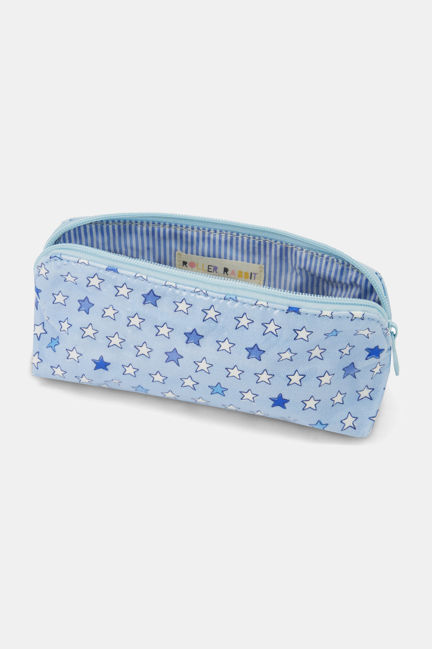 The Pop Stars Makeup Bag is a light blue cotton canvas pouch with white and blue stars, a zippered top, and a water-resistant blue and white striped interior.