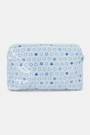 The Pop Stars Makeup Bag is a light blue, rectangular, water-resistant cotton canvas bag with a zipper and a blue and white outlined star pattern in various sizes.