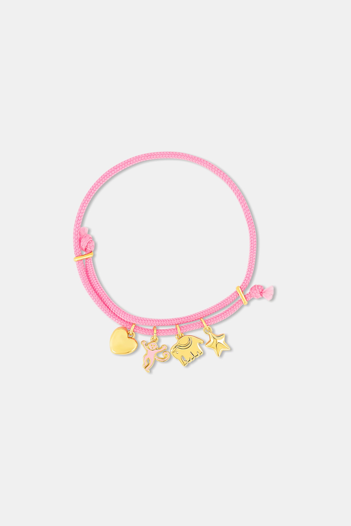 The Roller Rabbit Icon Party Charm Bracelet is a pink adjustable bracelet with five gold-tone charms—a heart, unicorn, butterfly, cat, and star—shown on a plain white background.