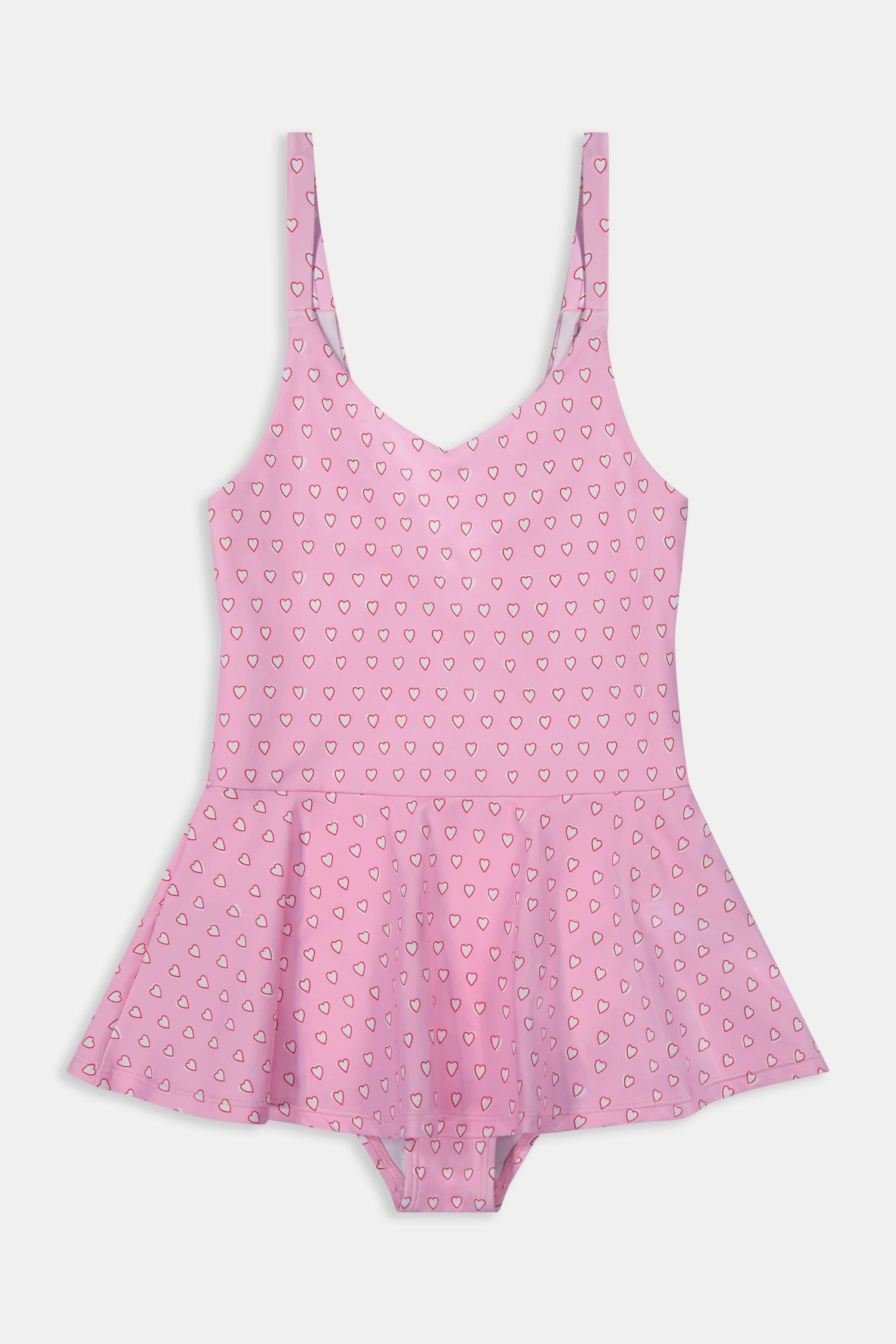 A young girl with long brown hair smiles confidently, wearing the Roller Rabbit Kids Hearts Dory One Piece swimsuit. She stands against a plain light gray background.