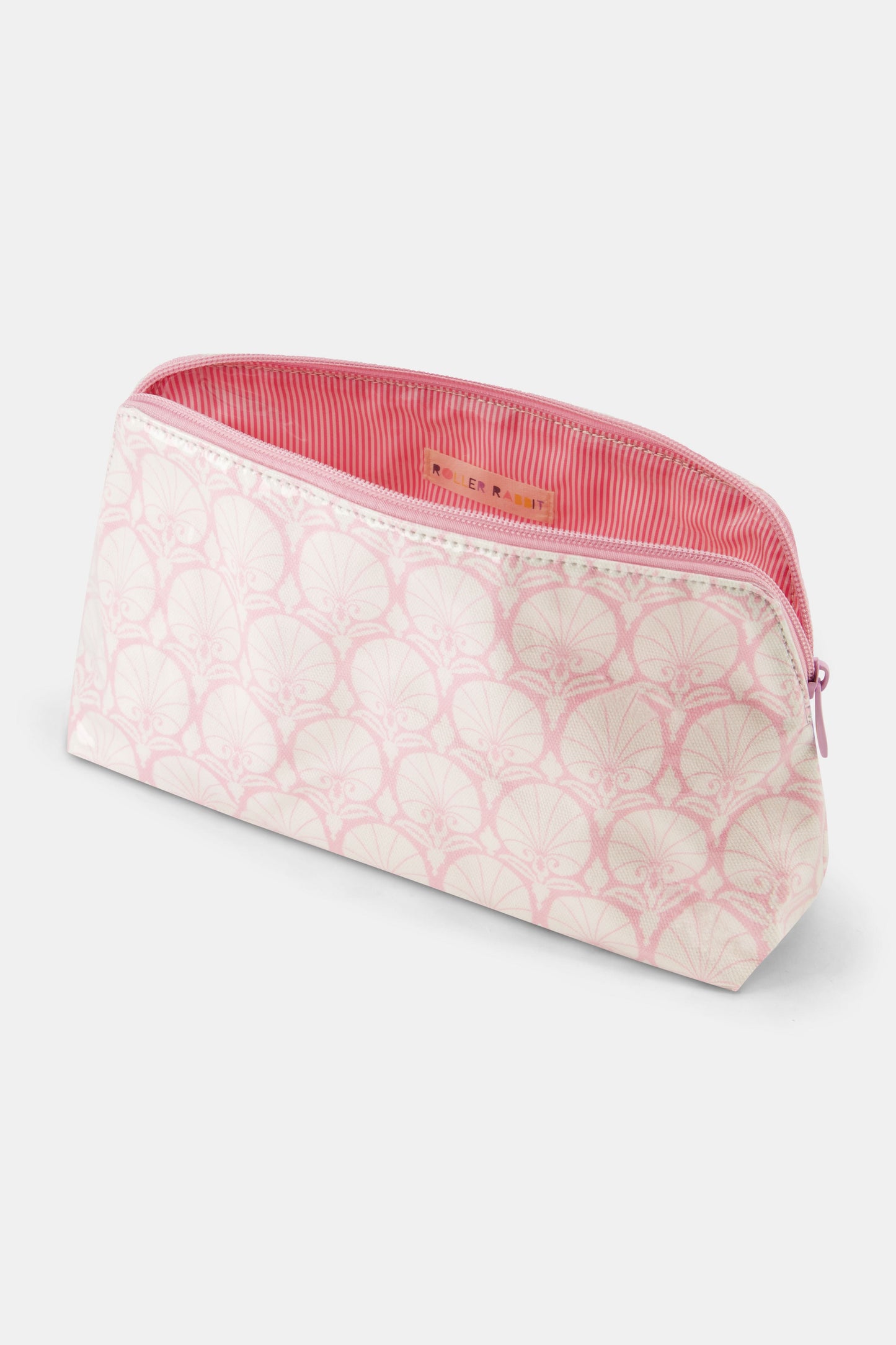 The Roller Rabbit Fan Geo Makeup Bag is a rectangular, zippered pink cotton canvas bag with a light pink and white art deco pattern, shown against a plain white background.