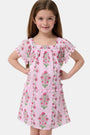 A young girl with long brown hair smiles, wearing the Roller Rabbit Kids Lily Stripe Oceana Dress. She stands with her hands on her hips against a plain light background.