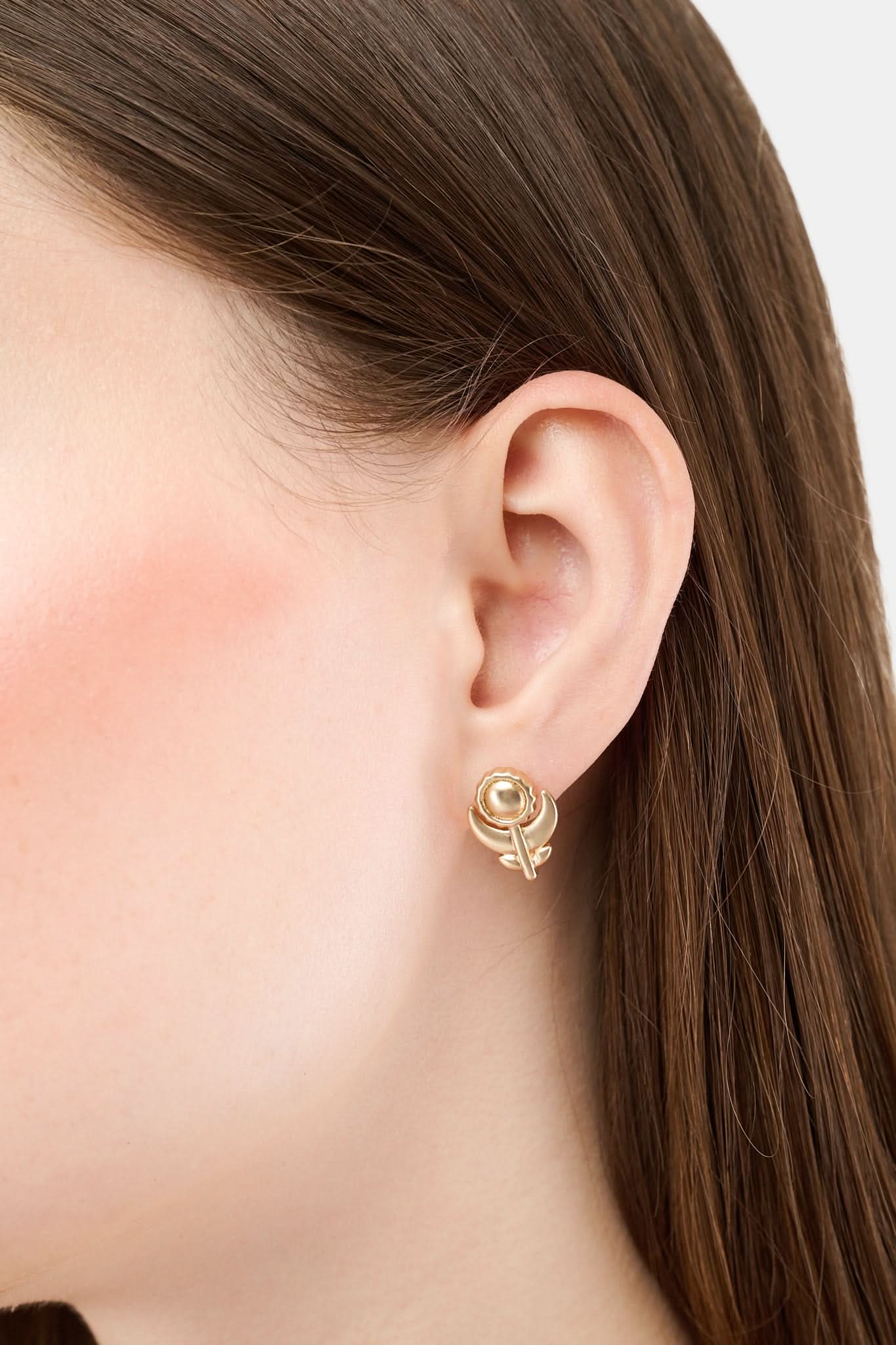 The Roller Rabbit Marquis Floral Stud features boho vintage gold flower studs with a round center and two leaves, shown against a plain light gray background.