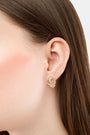 The Roller Rabbit Marquis Floral Stud features boho vintage gold flower studs with a round center and two leaves, shown against a plain light gray background.