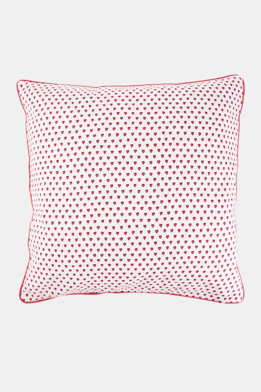The Roller Rabbit Hearts Decorative Pillow is a rectangular white pillow with an evenly spaced pink heart print and red piping, crafted from 100 cotton for comfort and softness.