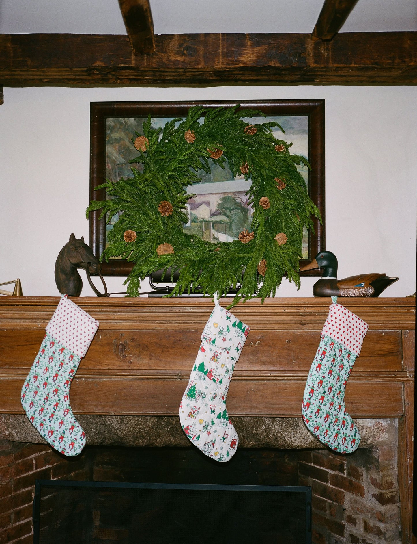 The Roller Rabbit Snow Village Quilted Stocking is a white 100 cotton Christmas stocking featuring festive prints like elves, candy canes, stars, snowmen, gifts, gingerbread house, Christmas trees—perfect for your holiday decor collection.