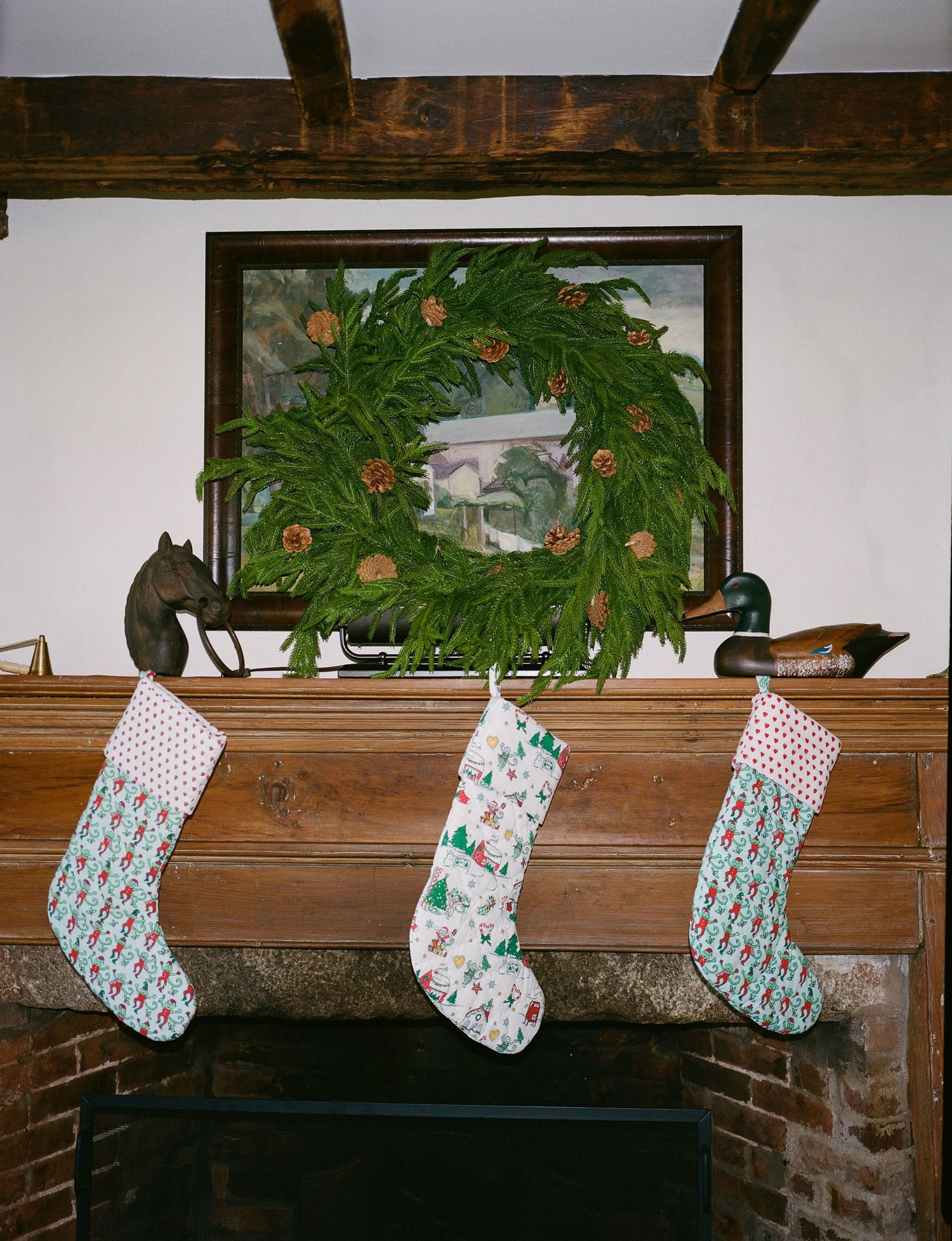The Roller Rabbit Snow Village Quilted Stocking is a white 100 cotton Christmas stocking featuring festive prints like elves, candy canes, stars, snowmen, gifts, gingerbread house, Christmas trees—perfect for your holiday decor collection.