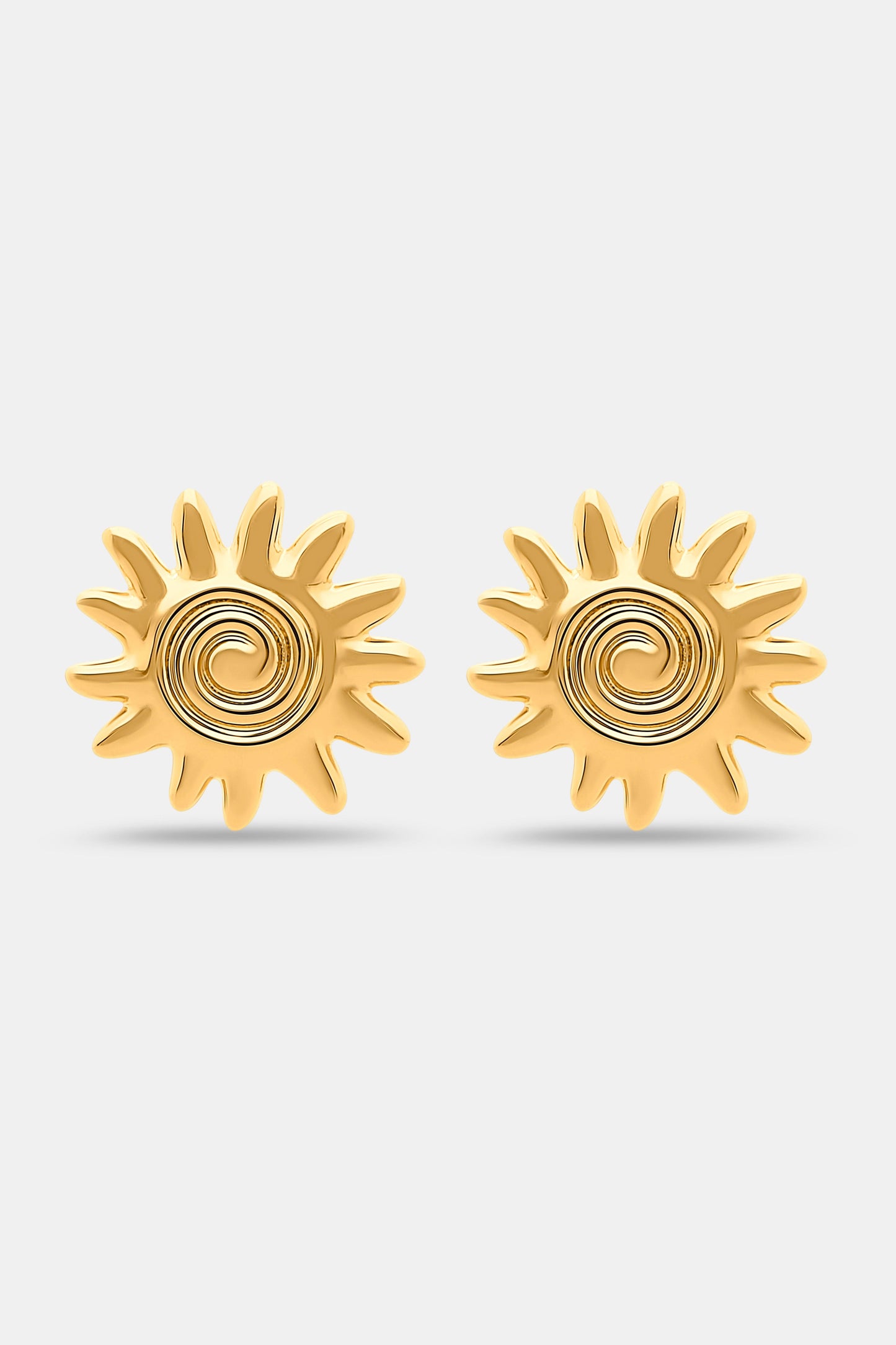 Roller Rabbit's Sunshine Stud Earrings showcase a gold sun-shaped design with a central spiral, displayed on a plain white background.