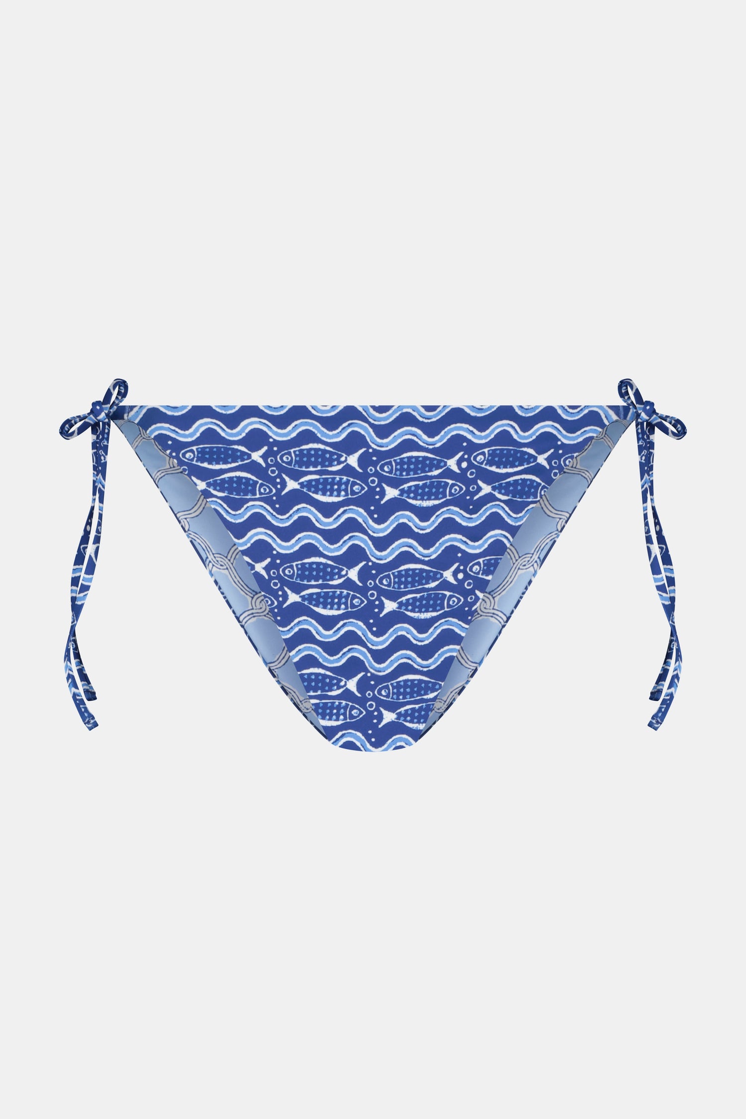 A person wears the Roller Rabbit Fish Stripe/Ruban Serena Bikini Bottom in blue with side ties, shown from torso to upper thighs against a plain white background. This bikini bottom offers UPF 50+ sun protection.