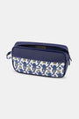The Roller Rabbit Mens Monkey Dopp Kit is a rectangular blue toiletry bag with playful blue monkeys on a white front pocket, water-resistant material, zipper closure, and a side handle for easy carrying.